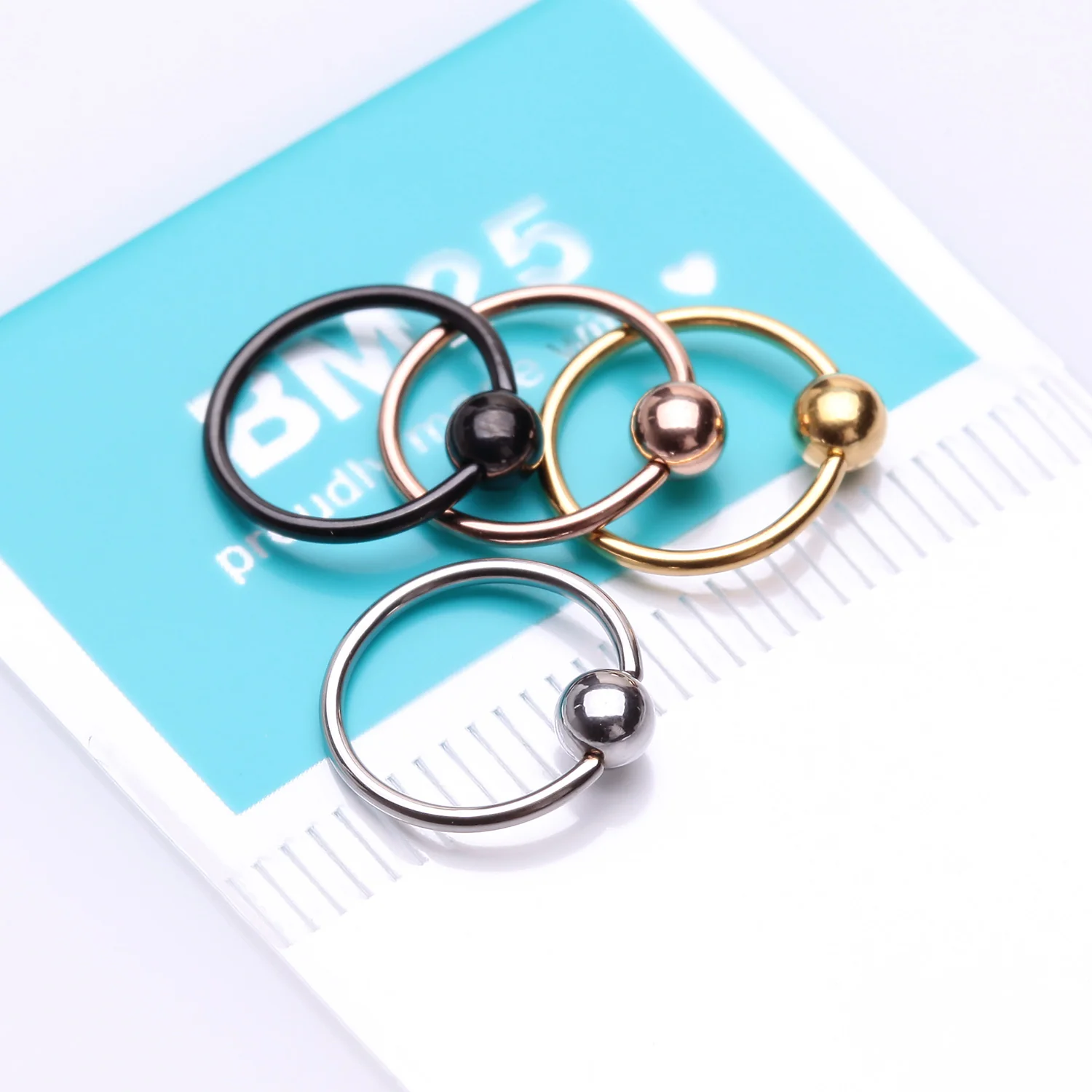 4 Pcs of Assorted Color Plated Fixed Ball CBR Style Bendable Hoop Ring Package - Image 2