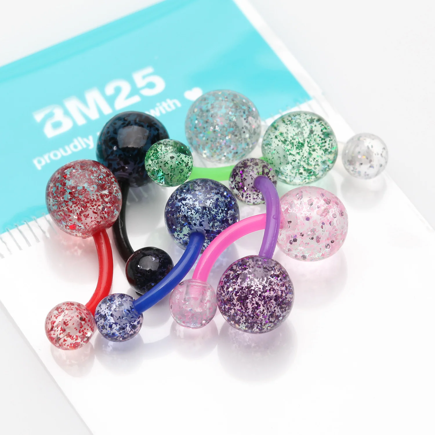 7 Pcs of Assorted Glittered Bio-Flex Belly Button Ring Package - Image 2