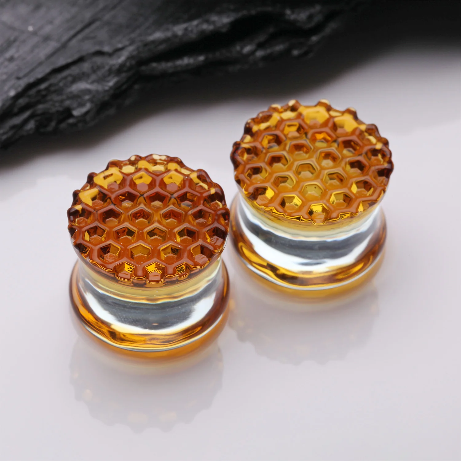 A Pair of Amber Honeycomb Glass Double Flared Plug - Image 2