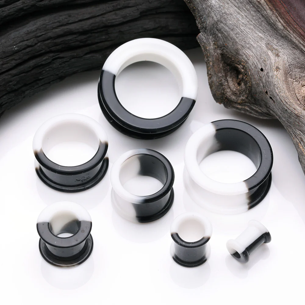 A Pair of Black and White Duo Tone Flexible Silicone Double Flared Tunnel Plug - Image 3