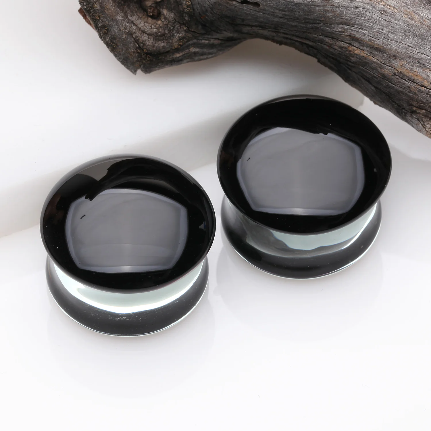 A Pair of Convex Black Front Glass Double Flared Ear Gauge Plug - Image 2