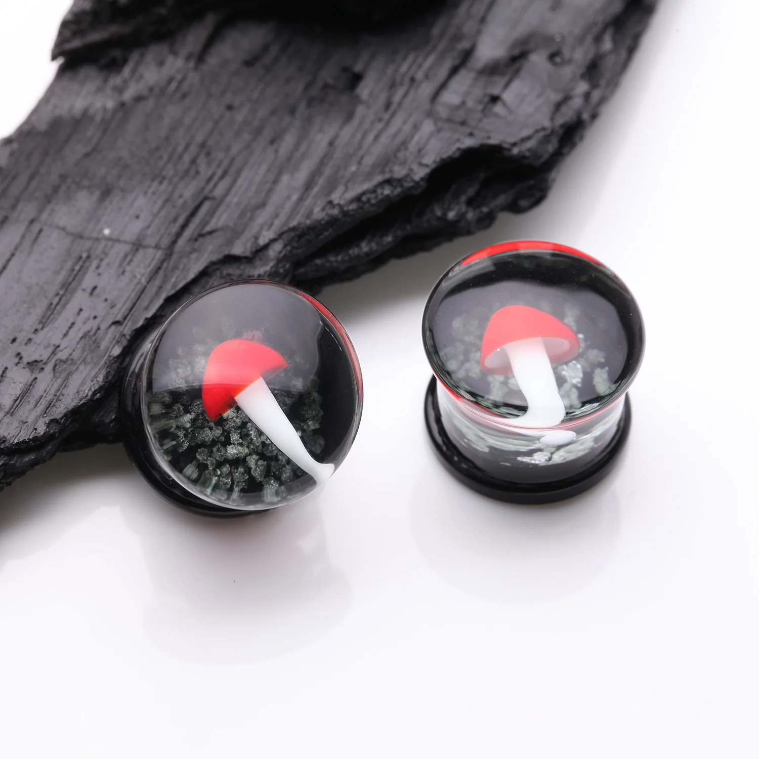 A Pair of Enchanted Red Mushroom Glow in the Dark Double Flared Glass Plug - Image 2